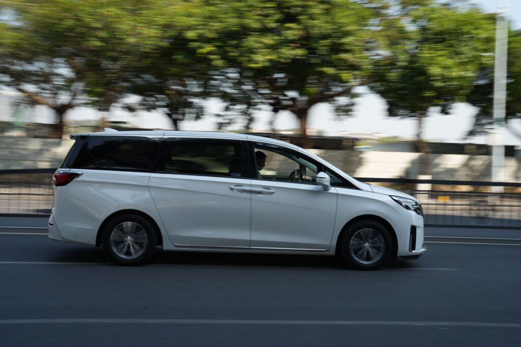 White_car_on_road_1080